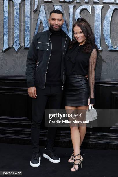 Jermaine Pennant and Jess Impiazzi arrive at the UK premiere of "Haunted Mansion" at Cineworld Leicester Square on July 25, 2023 in London, England.