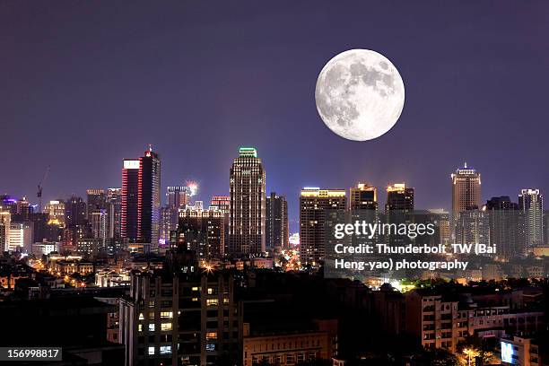 full moon upon lights of city - taichung stockfoto's en -beelden