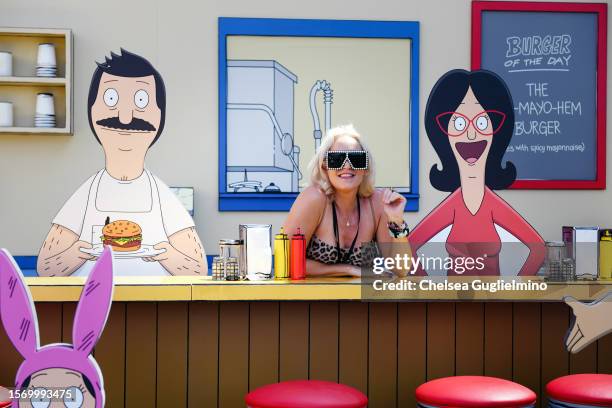 An attendee poses at the "Bob's Burgers" portion of the "Hulu Animayhem: Enter The 2nd Dimension" activation on July 20, 2023 in San Diego,...