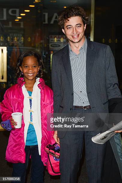 Actress Quvenzhane Wallis and director Benh Zeitlin leave the "Today Show" taping at the NBC Rockefeller Center Studios on November 26, 2012 in New...