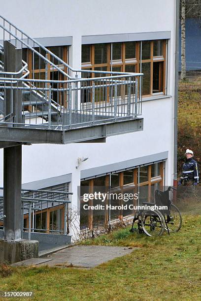 Wheelchair sits at the bottom of stairs at a Caritas employment facility for handicapped where a fire killed 14 people on November 27, 2012 in...