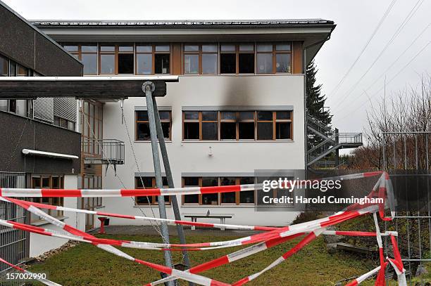 Caution tape surrounds the Caritas employment facility for handicapped where a fire killed 14 people on November 27, 2012 in Titisee-Neustadt,...