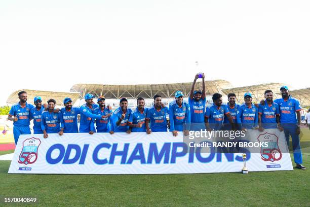 India cricketers pose after winning the 3rd and final ODI match between the West Indies and India at Brian Lara Cricket Academy in Tarouba, Trinidad...