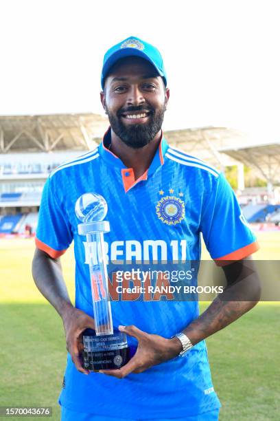 Hardik Pandya of India poses with the trophy after winning the 3rd and final ODI match between West Indies and India at Brian Lara Cricket Academy in...