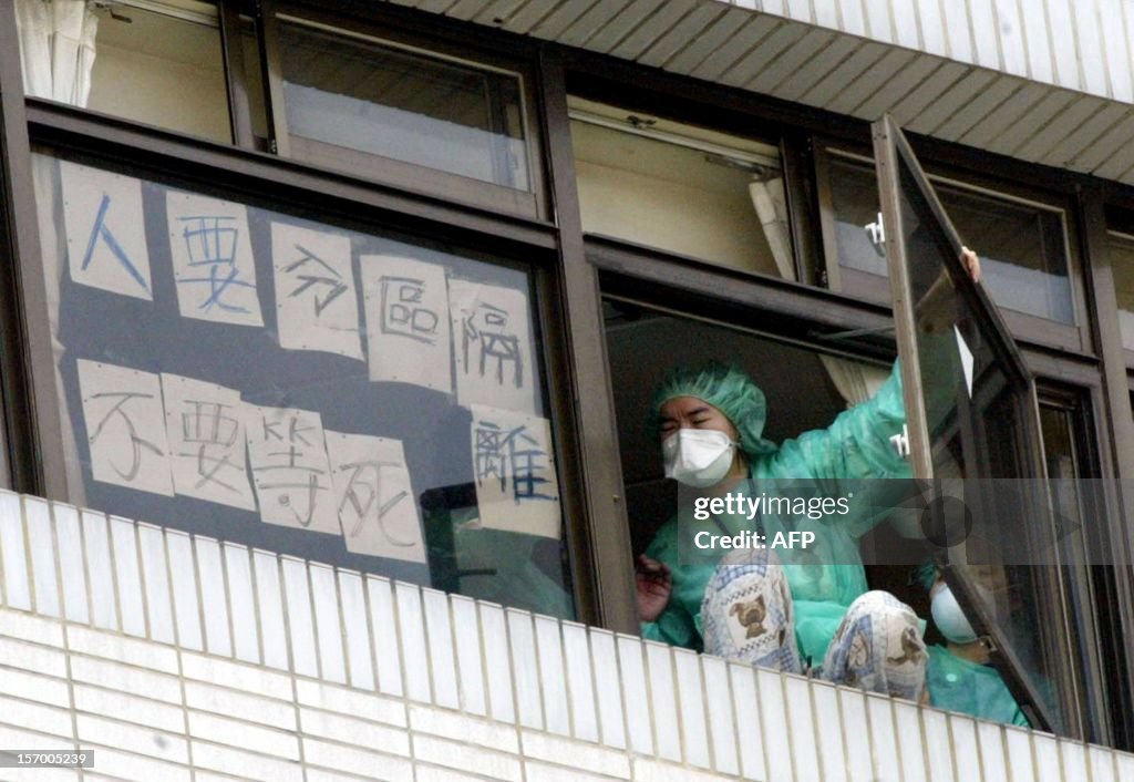 TOPSHOT-TAIWAN-HEALTH-SARS-NURSE-JUMP