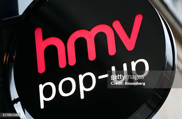Sign sits above the entrance to a HMV pop-up store in London, U.K., on Tuesday, Nov. 27, 2012. Fashion chain Hobbs is among those that have opened...