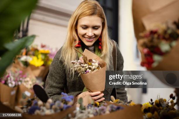woman choosing flower bouquet - buenos aires market stock pictures, royalty-free photos & images