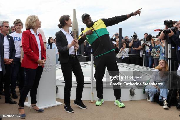 Ile-de-France Regional Council President Valerie Pecresse, Amélie Oudéa Castéra, French Minister for Sport, and former sprinter Usain Bolt pose with...