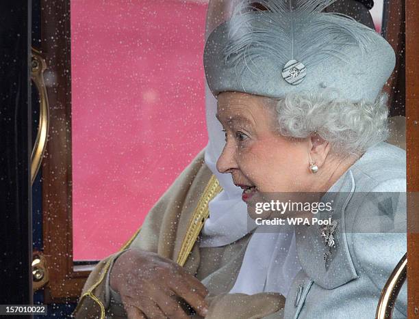 The Amir Sheikh Sabah Al-Ahmad Al-Jaber Al-Sabah of Kuwait and Prince Philip, Duke of Edinburgh acompany Queen Elizabeth II as they ride in a...