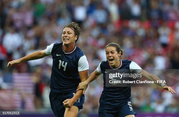 Abby Wambach and Kelley OHara of the USA celebrate after Carli Lloyd of the USA scored goal during the Women's Football Final match between the USA...