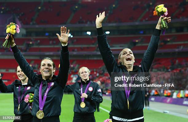 Rachel Buehler and Alex Morgan of the USA celebrate after the USA defeaded Japan at the Women's Football Final match between the USA and Japan on Day...