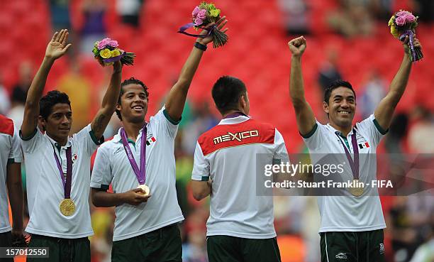 The players of Mexico celebrate at the end of the Men's Football Gold Medal match between Brazil and Mexico on Day 15 of the London 2012 Olympic...