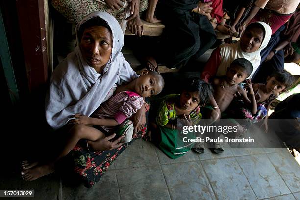 Rohingya wait for medical care at a school that is now a makeshift IDP camp November 24, 2012 on the outskirts of Sittwe, Myanmar. An estimated...
