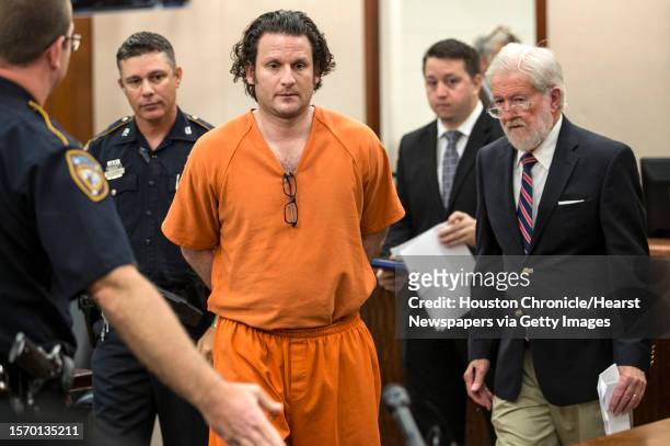 Leon Jacob, center, appears with his attorney, George Parnham, before felony judge Jim Wallace to request bond on Wednesday, July 12 in Houston....