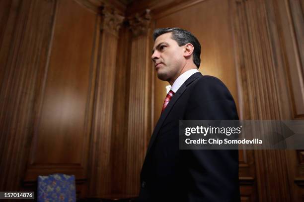 Mexican President-Elect Enrique Pena Nieto arrives for a photo opportunity after meeting with Democratic members of the House in the Rayburn Room at...