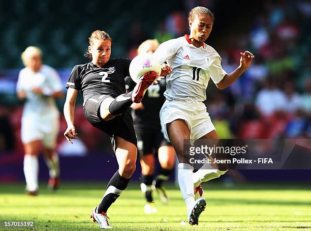 Kelly Smith of Great Britain and Ria Percival of New Zealand compete for the ball during Women's Group E match between Great Britain and New Zealand...