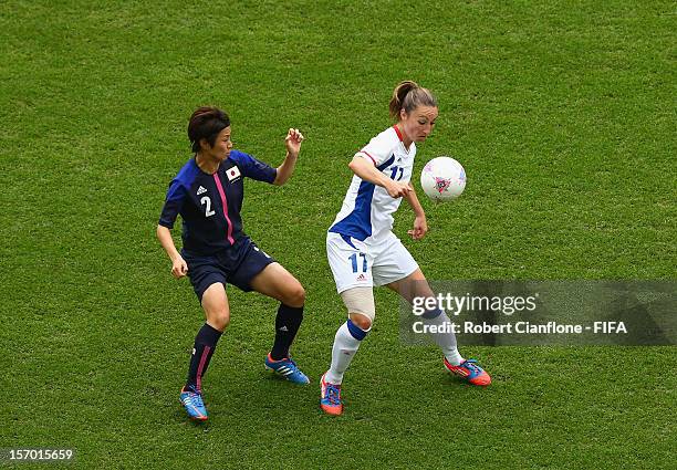 Gaetane Thiney of France is pressured by Yukari Kinga of Japan during the Women's Football Semi Final match between France and Japan on Day 10 of the...