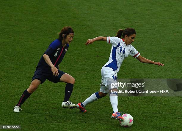 Louisa Necib of France is chased by Mizuho Sakaguchi of Japan during the Women's Football Semi Final match between France and Japan on Day 10 of the...