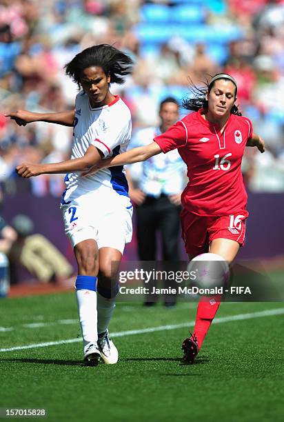 Jonelle Filigno of Canada battles with Wendie Renard of France during the Women's Football Bronze Medal match between Canada and France, on Day 13 of...