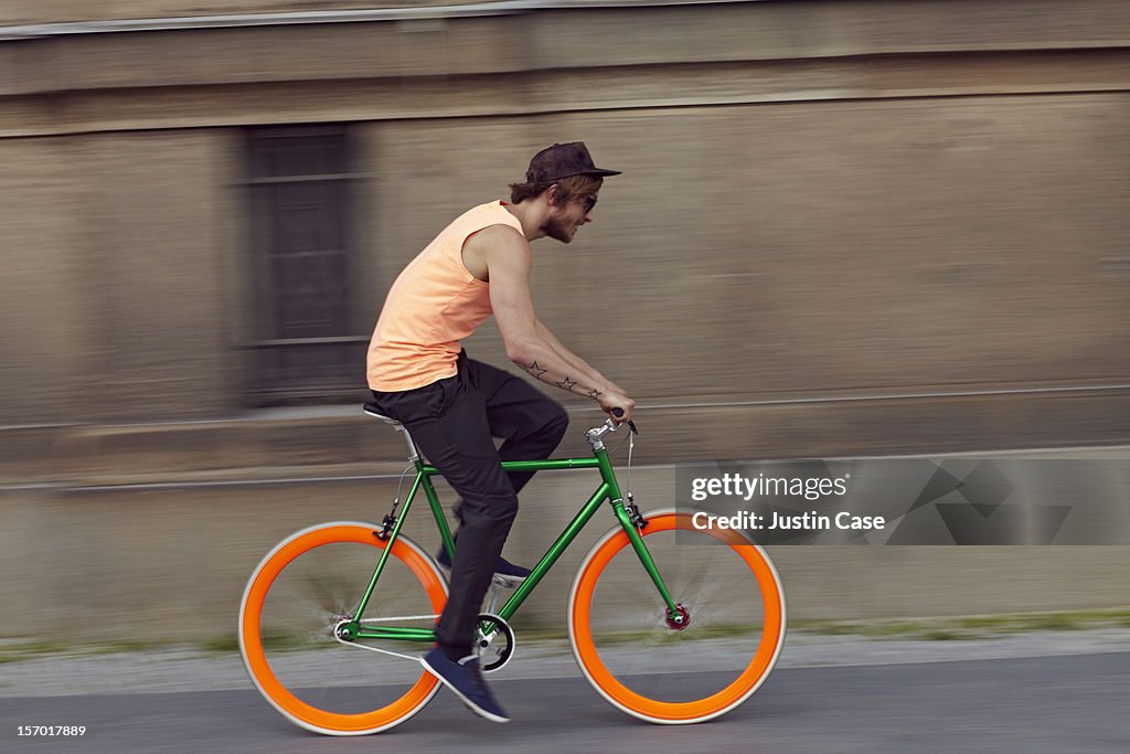 A action shot of a  man riding on a bike