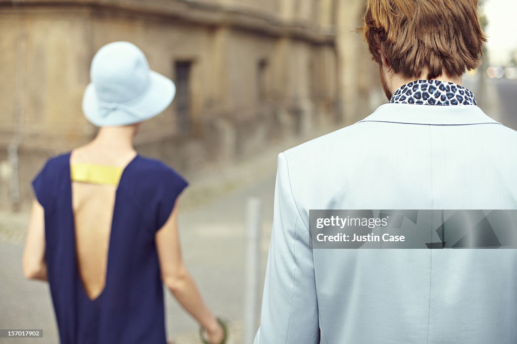 A young couple walking through the city
