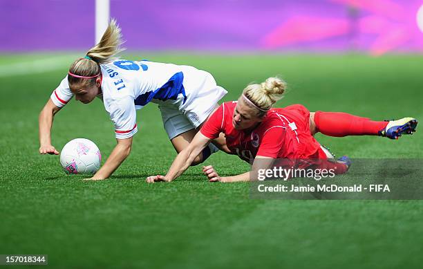 Lauren Sesselmann of Canada battles with Eugenie le Sommer of France during the Women's Football Bronze Medal match between Canada and France, on Day...