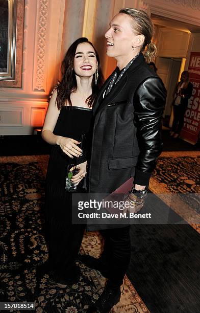 Lily Collins and Jamie Campbell Bower attend a drinks reception at the British Fashion Awards 2012 at The Savoy Hotel on November 27, 2012 in London,...