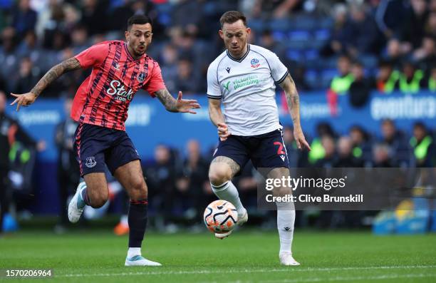 Gethin Jones of Bolton Wanderers under pressure from Dwight McNeil of Everto during the pre-season friendly match between Bolton Wanderers and...