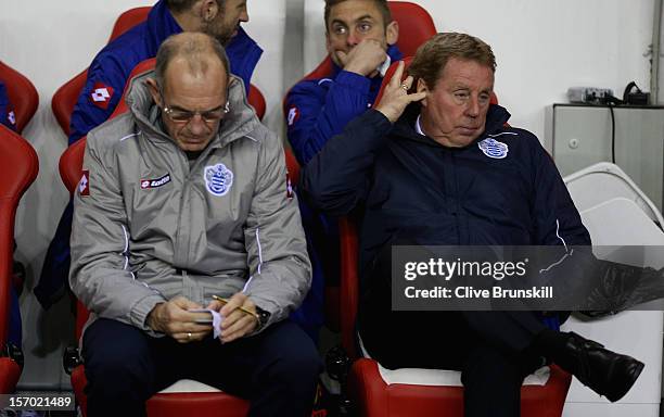 Queens Park Rangers manager Harry Redknapp sits next to his assistant manager Joe Jordan during the Barclays Premier League match between Sunderland...