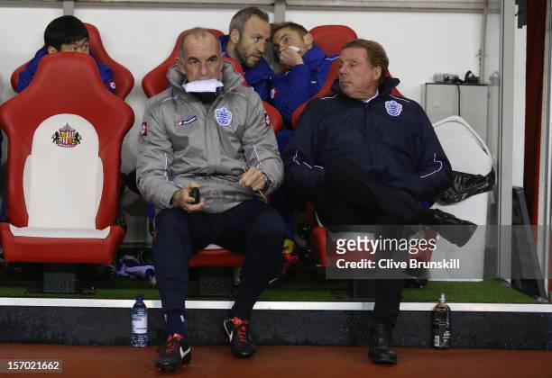 Queens Park Rangers manager Harry Redknapp sits next to his assistant manager Joe Jordan during the Barclays Premier League match between Sunderland...