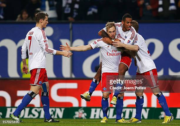 Maximilian Beister of Hamburg celebrates with his team mates after scoring his team's first goal during the Bundesliga match of Hamburger SV and FC...