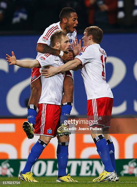 Maximilian Beister of Hamburg celebrates with his team mates after scoring his team's first goal during the Bundesliga match of Hamburger SV and FC...