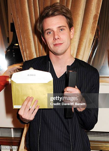 Jonathan Anderson of JW Anderson, winner of the Emerging Talent award, Ready-To-Wear, poses with award at the British Fashion Awards 2012 at The...