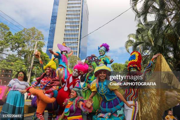 People in leprechaun costumes dance during a traditional parade to inaugurate the Patron Saint Festivities to the "Divino Salvador del Mundo", on...