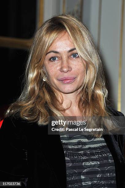 Emmanuelle Beart poses after being honored the Officier des Arts et des Lettres at Ministere de la Culture on November 27, 2012 in Paris, France.