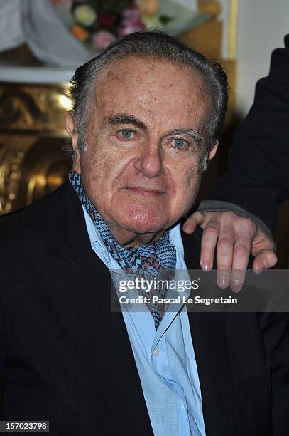 Guy Beart poses as his daughter Emmanuelle Beart is decorated as the Officier des Arts et des Lettres at Ministere de la Culture on November 27, 2012...