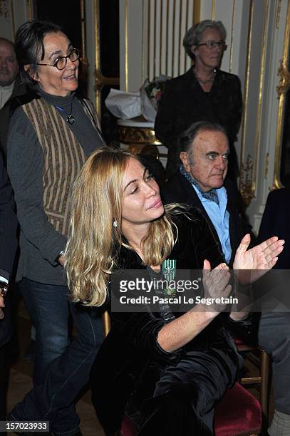 Emmanuelle Beart poses with her mother Genevieve Galea and father Guy Beart at Ministere de la Culture on November 27, 2012 in Paris, France.