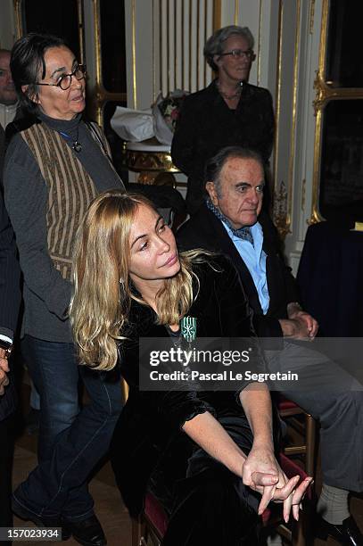 Emmanuelle Beart poses with her mother Genevieve Galea and father Guy Beart at Ministere de la Culture on November 27, 2012 in Paris, France.