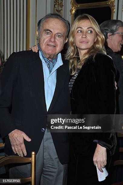 Emmanuelle Beart poses with her father Guy Beart at Ministere de la Culture on November 27, 2012 in Paris, France.