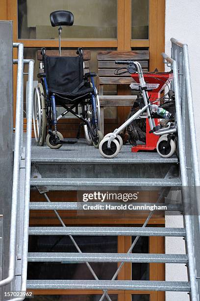 Wheelchair sits at the top of stairs at a Caritas employment facility for handicapped where a fire killed 14 people on November 27, 2012 in...