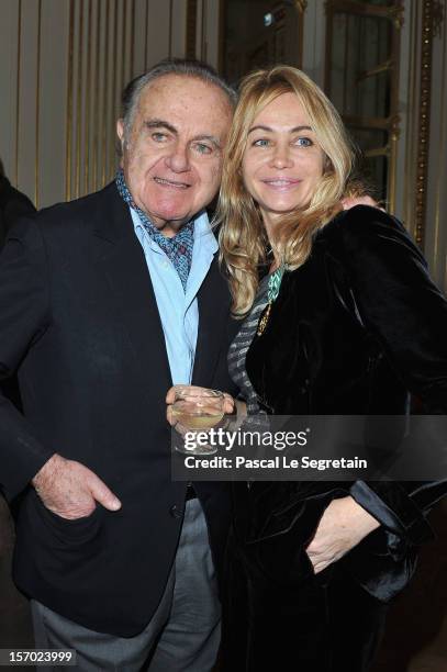 Emmanuelle Beart poses with her father Guy Beart after being honored the Officier des Arts et des Lettres at Ministere de la Culture on November 27,...