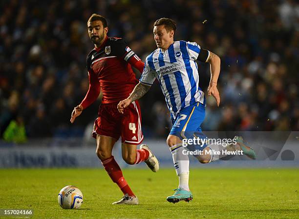 Will Hoskins of Brighton bursts past Liam Fontaine of Bristol City during the npower Championship match between Brighton & Hove Albion and Bristol...