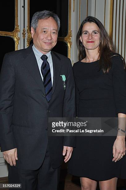 Director Ang Lee poses with French Minister of culture and Communication Aurelie Filippetti after being honored the Officer des Arts et des Lettres...