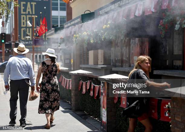 Misters blow water amid the city's worst heat wave on record on July 25, 2023 in Phoenix, Arizona. While Phoenix endures periods of extreme heat...