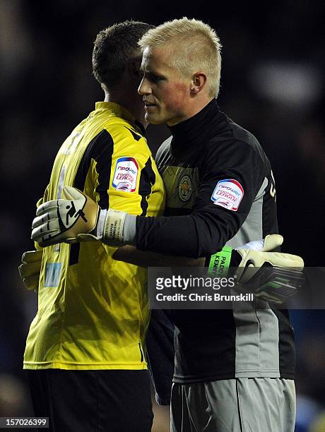 Kasper Schmeichel of Leicester City embraces Paddy Kenny of Leeds United at full-time following the npower Championship match between Leeds United...