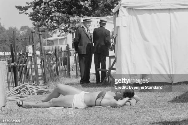 Woman sunbathing at Henley Royal Regatta, Henley-on-Thames, Oxfordshire, 2nd July 1976.