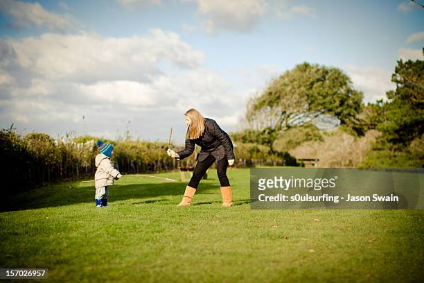park life - sword fight with mum - s0ulsurfing stock pictures, royalty-free photos & images
