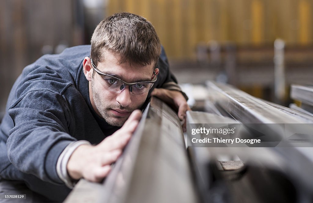 Worker in metal worshop