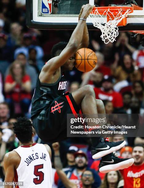 Houston Rockets center Clint Capela dunks over Miami Heat forward Derrick Jones Jr. During the fourth quarter of an NBA basketball game at Toyota...