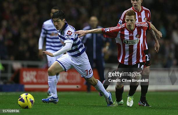 Ji-Sung Park of Queens Park Rangers moves away from Jack Colback of Sunderland during the Barclays Premier League match between Sunderland and Queens...